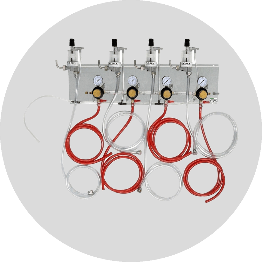 A beer regulator panel with multiple regulators and hoses for precise gas control in draft beer systems.